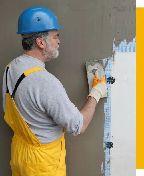 Worker patching the wall